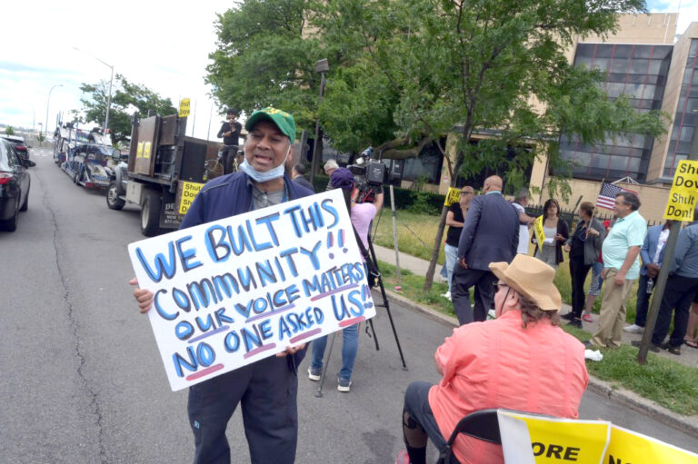 Queens residents rally to shut down NYC migrant shelter where cop-shooting suspect lived